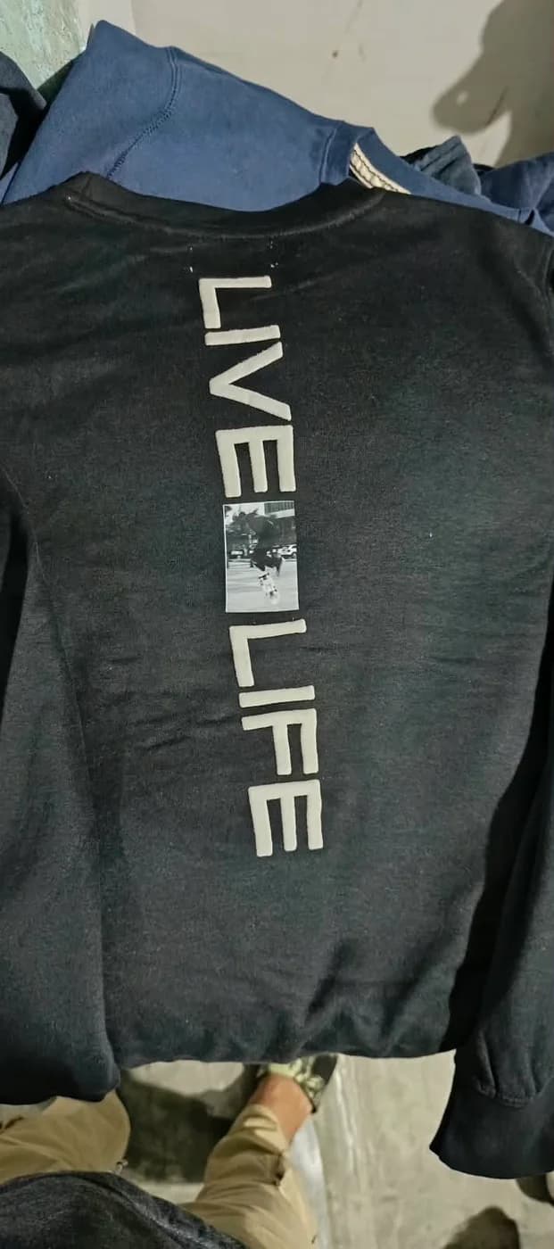 Black crewneck sweatshirt with a white Live Life print down the back